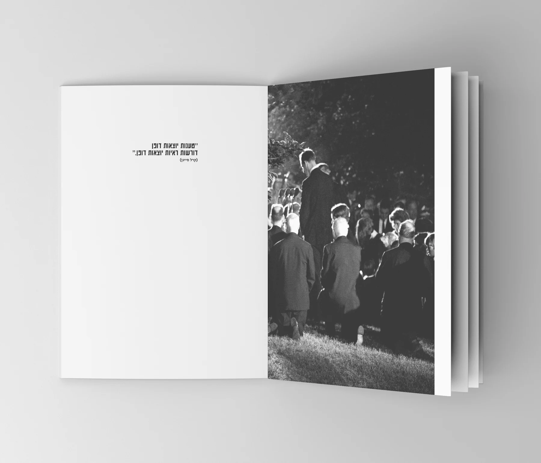 Booklet spread: a full-page black and white photograph beside a quiet white page